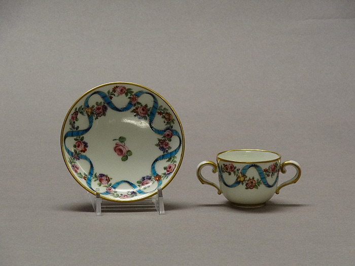 Two-Handled Cup and Saucer Slider Image 1