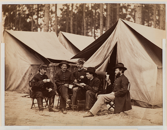 Civil War Scene: five soldiers sitting among tents
