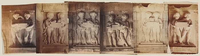 Statues of Cherubs Holding Slate