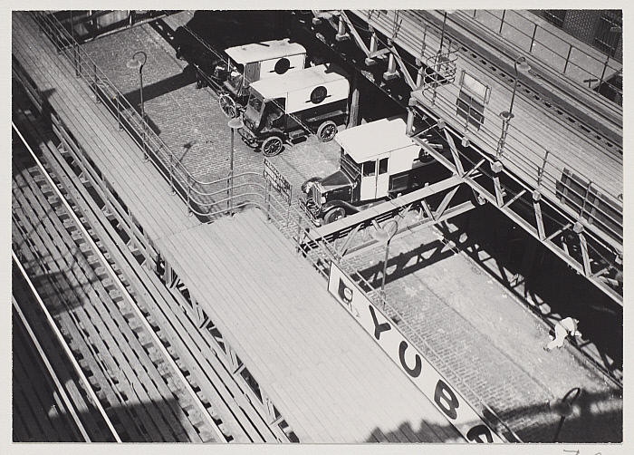 Untitled [Delivery trucks under the Second Avenue Elevated, New York]
