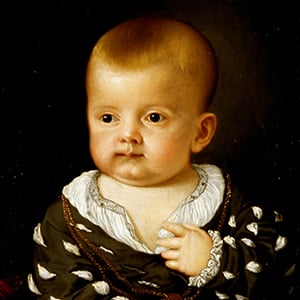 An Infant Holding an Apple