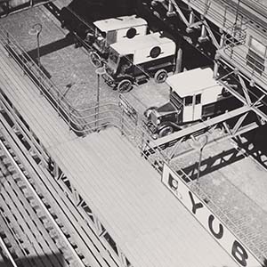 Untitled [Delivery trucks under the Second Avenue Elevated, New York]
